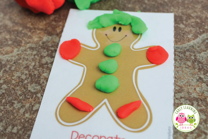 mini holiday playdough mat for kids - gingerbread playdough mat with green and red playdough
