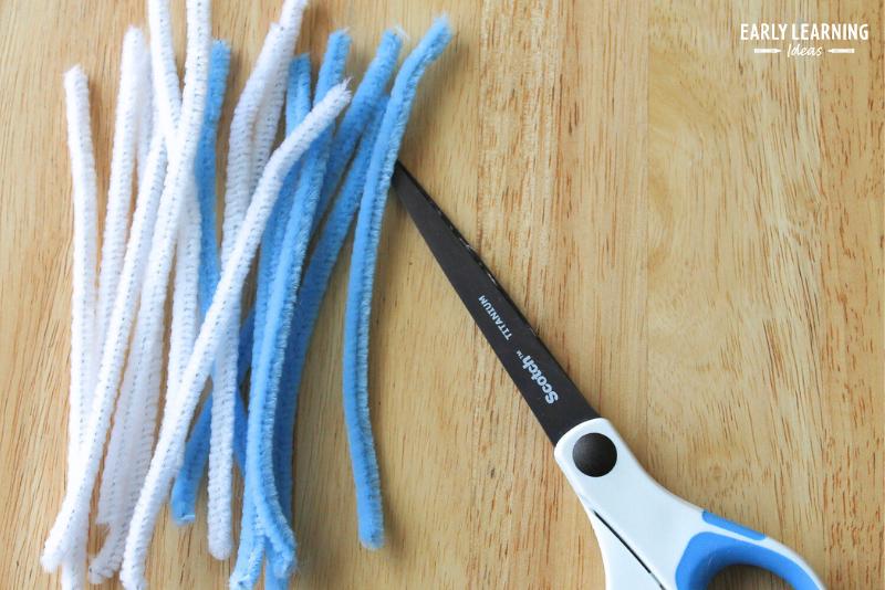 Start by cutting your pipe cleaners in half for your beaded snowflake craft. 