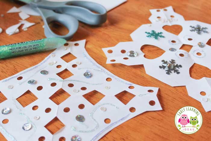 Using glitter for your paper snowflake craft activity.  