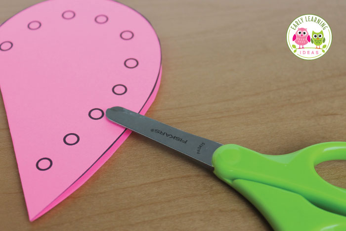 Practice preschool cutting skills with this Valentine's Day fine motor skill activity.  