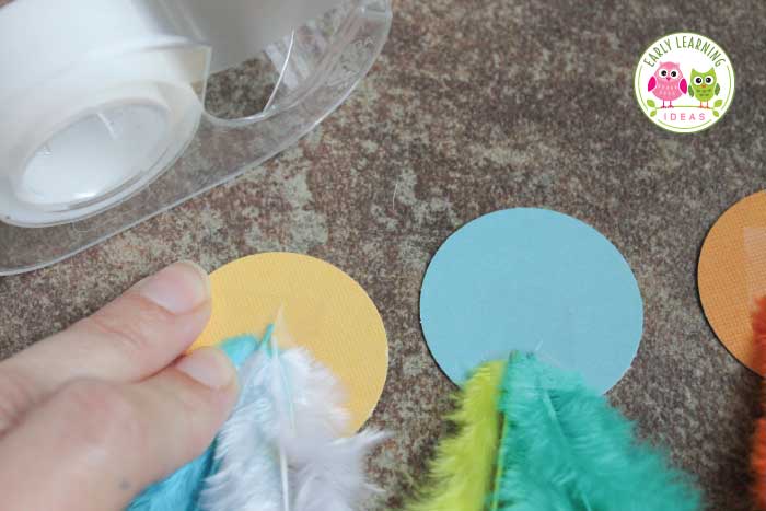 tape feathers to the circles
