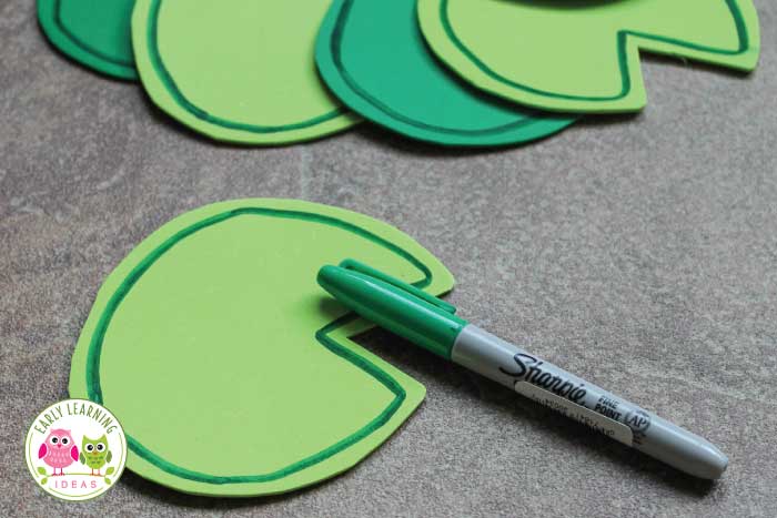 Trace and cut out your foam lily pad frog activity counters.  