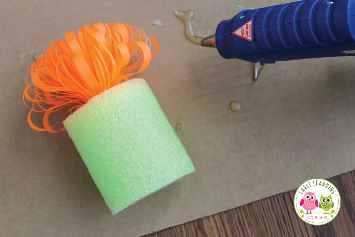 Add a ribbon to the end of your pool noodle for an easy art idea for kids.