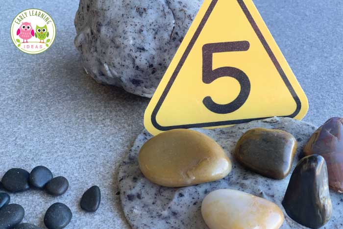 Adding rocks to your construction themed playdough activity. 