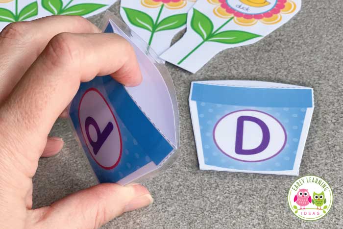 Fold your flowerpot in half and place it inside a laminated pouch for your flower literacy activity.