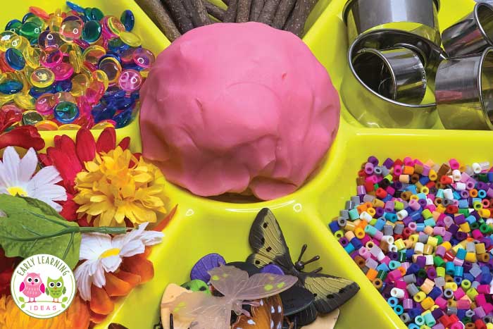 Materials ideas for your butterfly themed playdough tray. 