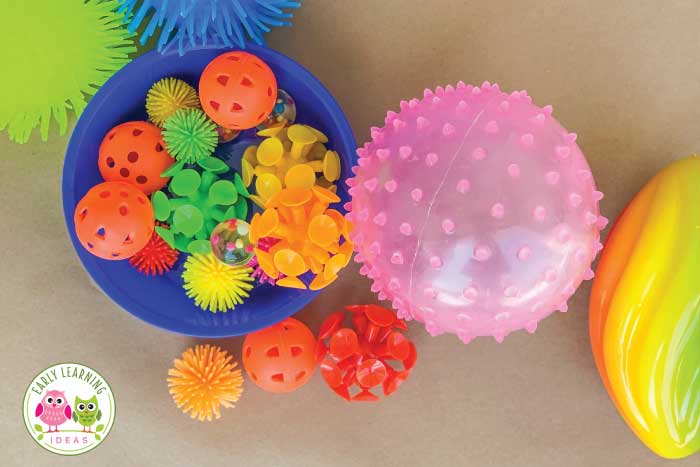 Go ahead and grab all different types of balls for this painting with balls activity.  