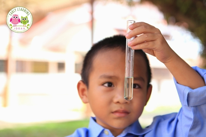 Preschool child doing a water experiment