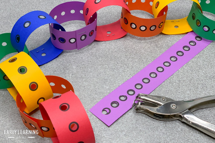 Make paper chains with hole punch strips
