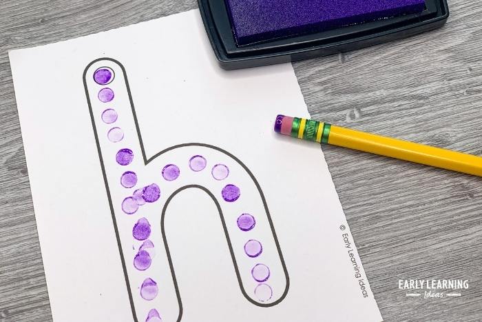 Use an eraser and stamp pad to make letters of the alphabet