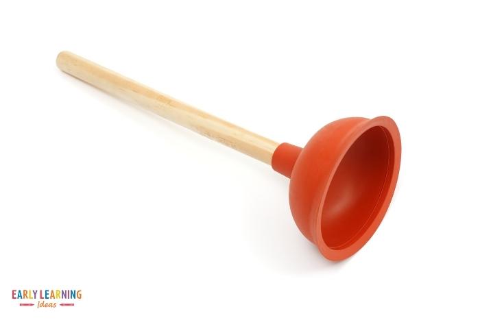 Let kids play with a dollar store plunger to build hand strength and fine motor skills