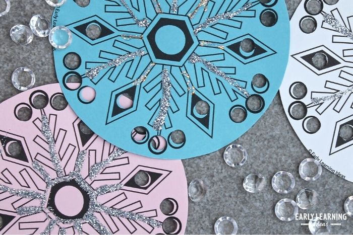 Decorate the snowflake printable with glitter and gems