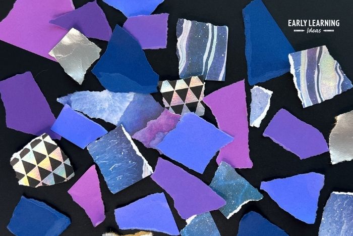 Torn Paper Process Art.  Purple, blue and silver scraps of torn paper on a black piece of paper. - and example of paper tearing activities for preschoolers.