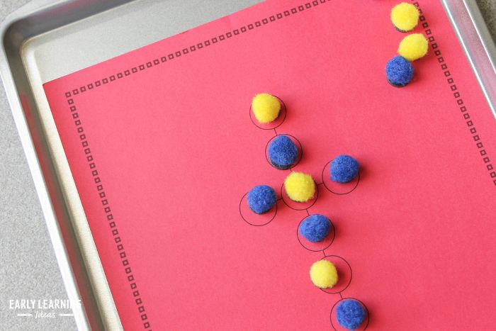 Use magnetic puffballs with your alphabet dot letters.
