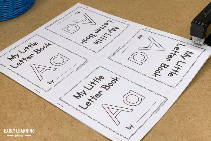 Use a stapler to assemble the alphabet letter books for preschoolers