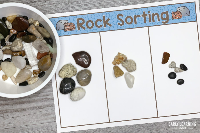 sort a rock collection in a preschool geology lab dramatic play center