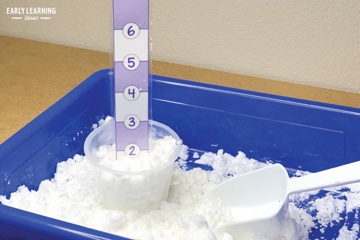 measure snow in the weather station dramatic play area for your preschoolers
