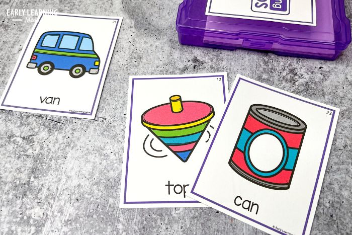 how to teach rhyming words with phonological awareness activities and rhyming cards.  Kids see 3 cards van, top, and can so that they can see that van rhymes with can
