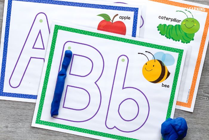 These playdough ats are one of 8 different fun ways to teach the alphabet.  The printable letter B mat has a coil of playdough forming the letter B.
