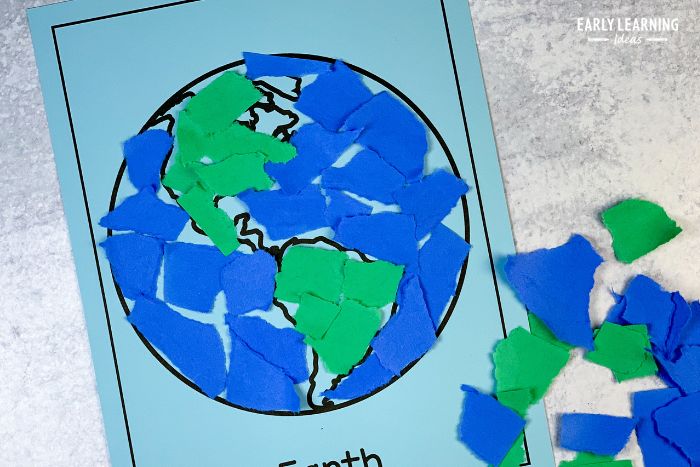 A printable Earth with pasted bits of torn paper on it.  This is an example of  tearing paper activities for preschoolers