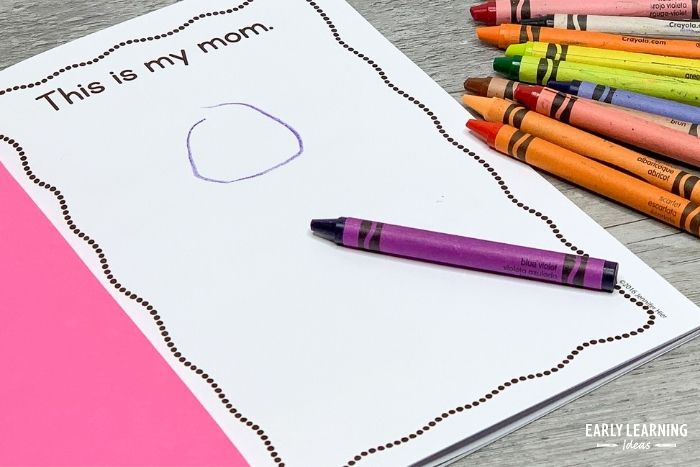 A child drawing in a book - a printable book is a great and easy preschool mothers day book for kids to make.