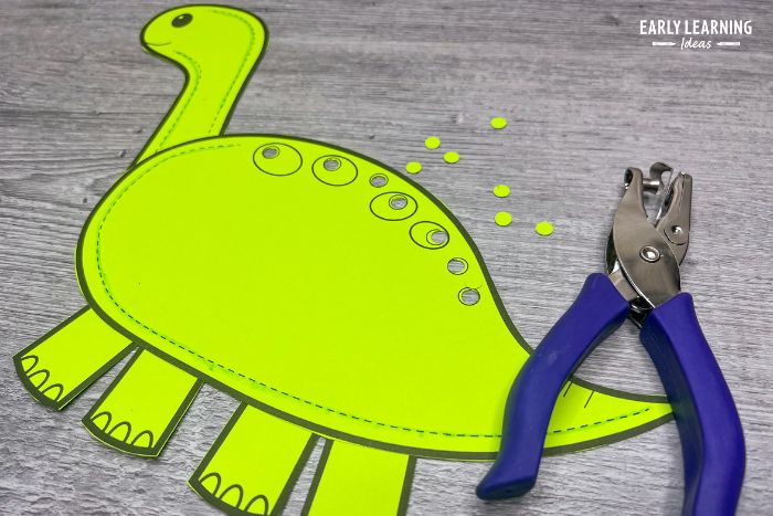 dinosaur hole punch craft is an example of printable fine motor crafts and activities for kids