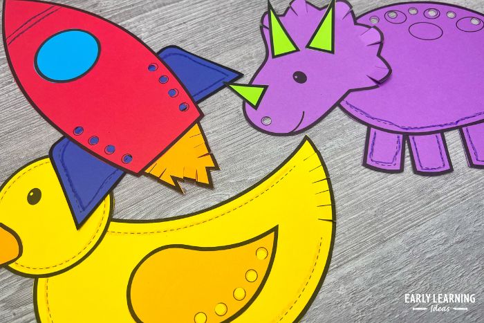 a rocket, dinosaur, and duck are printable fine motor crafts for kids with opportunities for scissor skills and snipping practice.