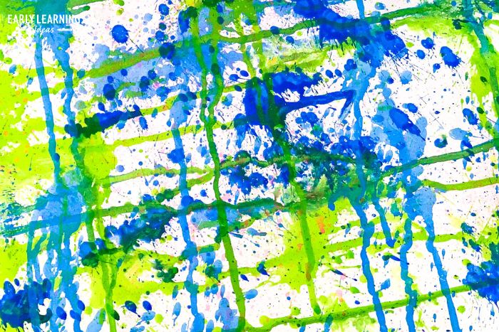 squirt gun painting - the best simple summer art projects for preschoolers. Art made with a water gun and blue, green, and white paint.  This is an example of a painting activities
 to promote fine motor skills.
