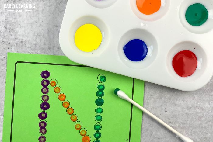 A paint tray from Dollar Tree is used for q-tip letter activity for the letter N. - an example of supplies for dollar store preschool ideas and activities.