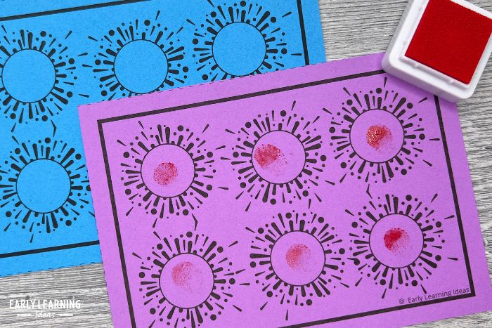 a fine motor task card with a red stamp pad and shown with fingerprints on the task card.