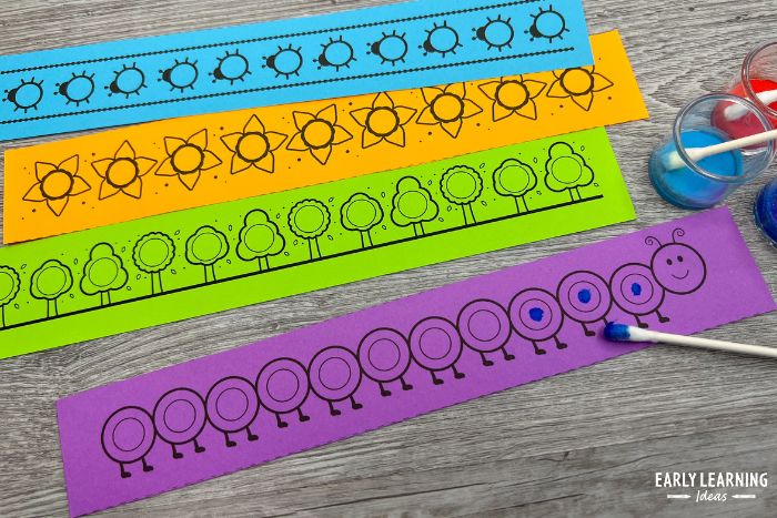 colorful dot sticker printables with q-tips and small plastic containers with paint.