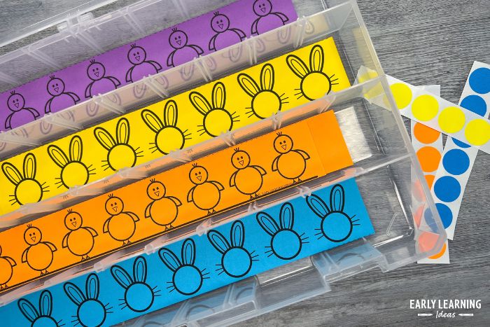 bun dot sticker printables in a plastic box with brightly colored stickers - an example of simple fine motor activities for preschoolers