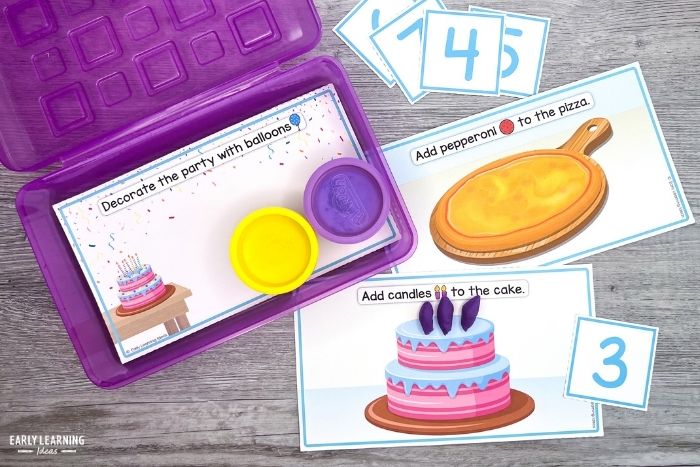 birthday celebration theme playdough mats with number cards, playdough, and a task box.