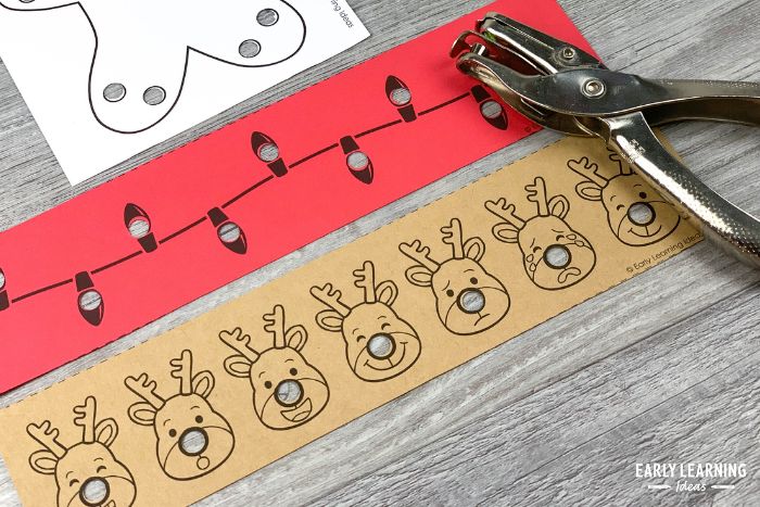 Christmas fine motor hole punch strips in reindeer and light strand theme