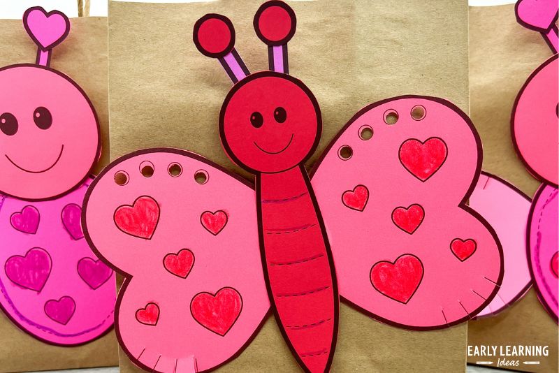 A printable love bug Valentine's Day craft added to a brown bag to create a cute Valentin bag for kids.