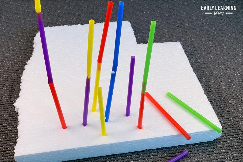 an example of how to build a tower- a tower made from plastic straws stuck in a sheet of foam