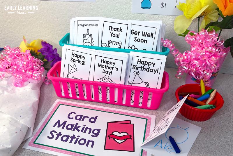Card making station with printable birthday cards, congratulations, get well, and Thank you cards in a flower shop dramatic play area.
