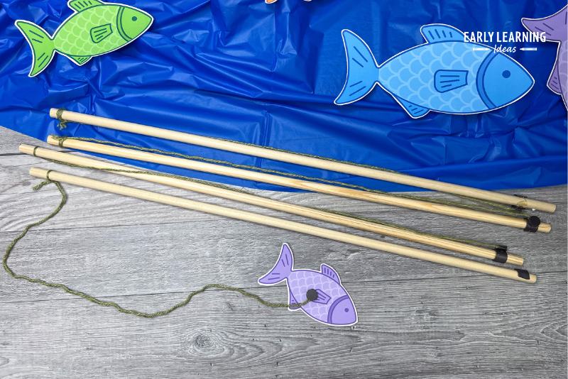 fishing poles made from wooden dowels, yarn, and magnets