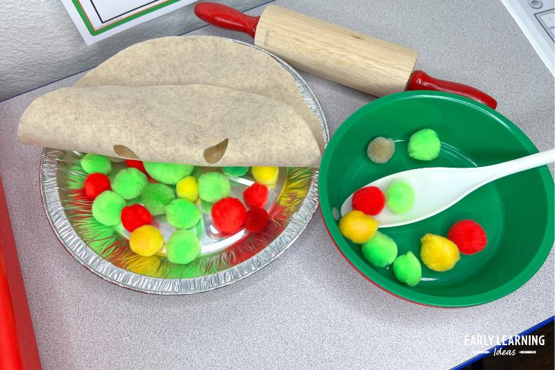 pretend apple pie made with pom poms and felt in a pie tin