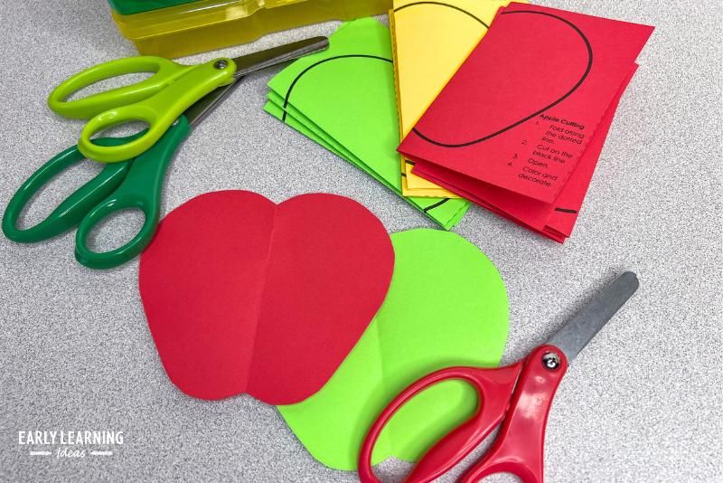 fold and cut apples - the cutting activity is shown with scissors