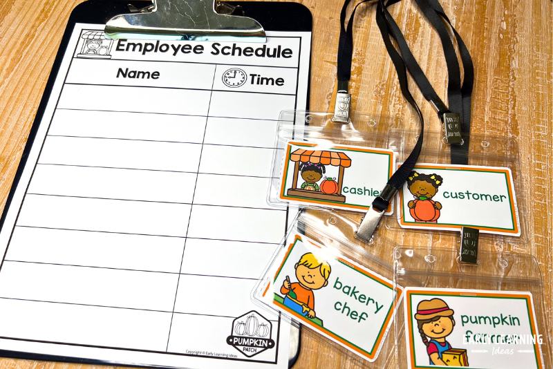 schedule and role tags on lanyards used in a pumpkin patch and bakery dramatic play center