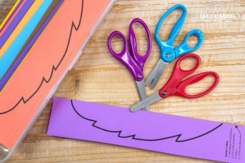 paper feather template shown with scissors