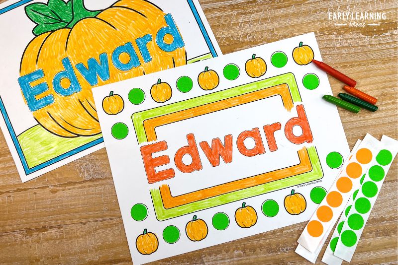 Pumpkin theme name coloring page with the name Edward printed on it shown with crayons and orange and green dot stickers