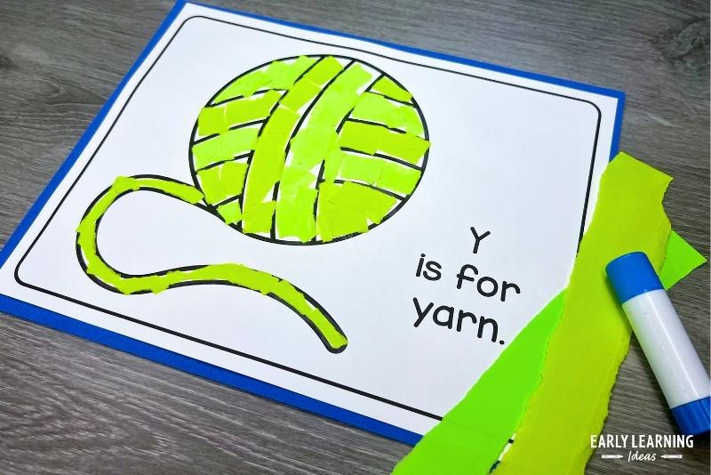 Y is for yarn craft - Easy crafts for the letter y shown with torn paper and lue stick.