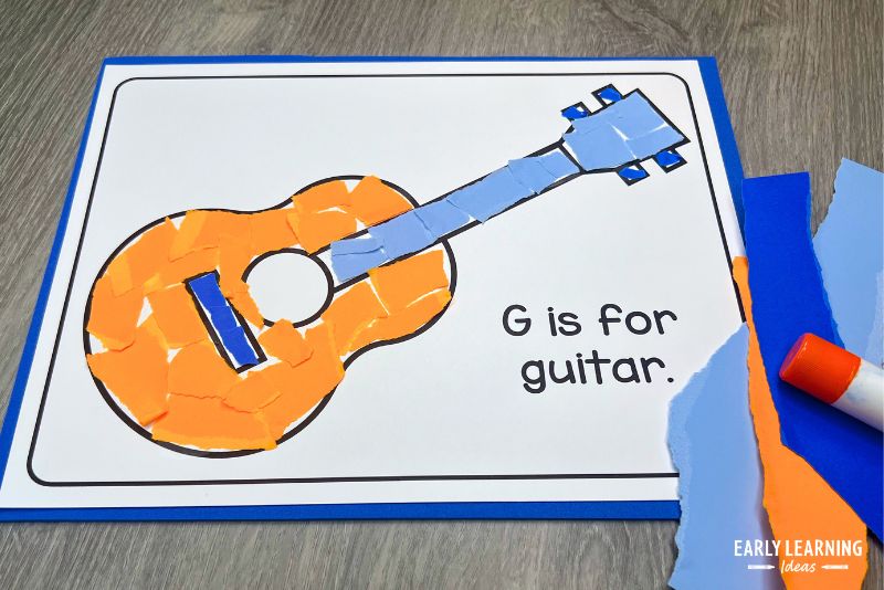 G is for guitar letter g crafts for preschool shown with torn paper and a glue stick