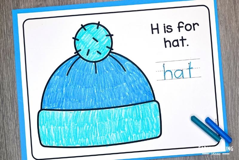 H is for hat craft for preschoolers shown with crayons