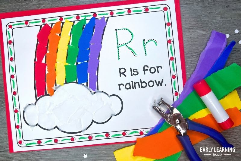 Preschool crafts for the letter R - R is for rainbow craft shown with hole punch, torn paper, and glue stick.