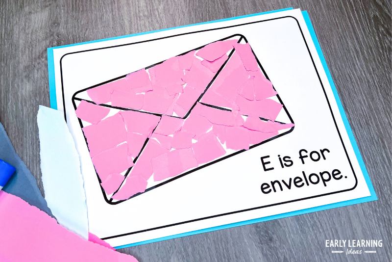E is for envelope letter E craft shown with pink torn paper