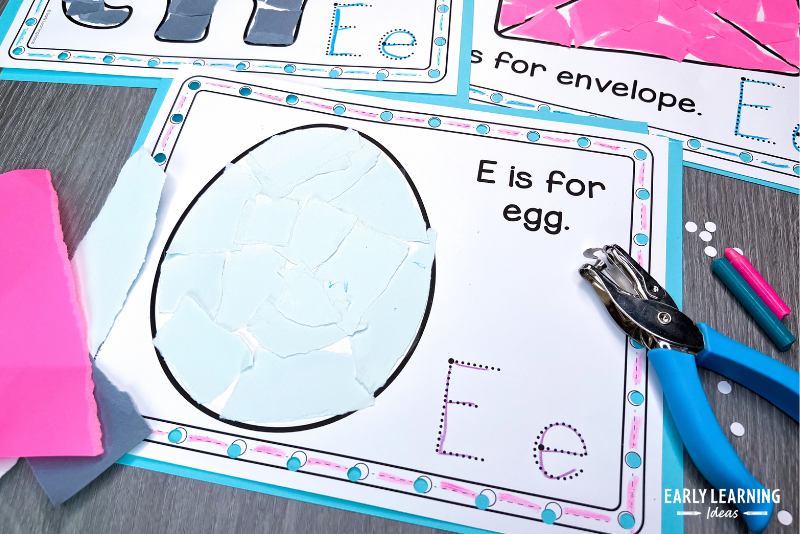 E is for egg letter E craft page shown with a hole punch and crayons
