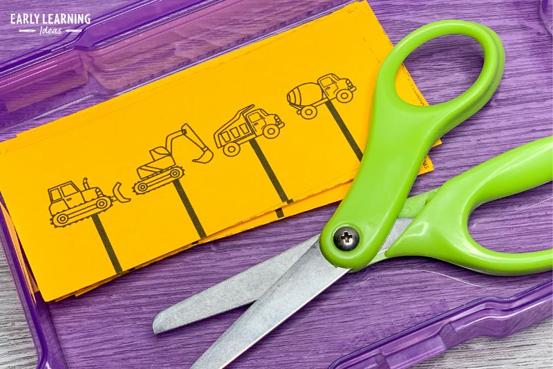 snip strips in a task box with scissors - fine motor activities for preschool kids